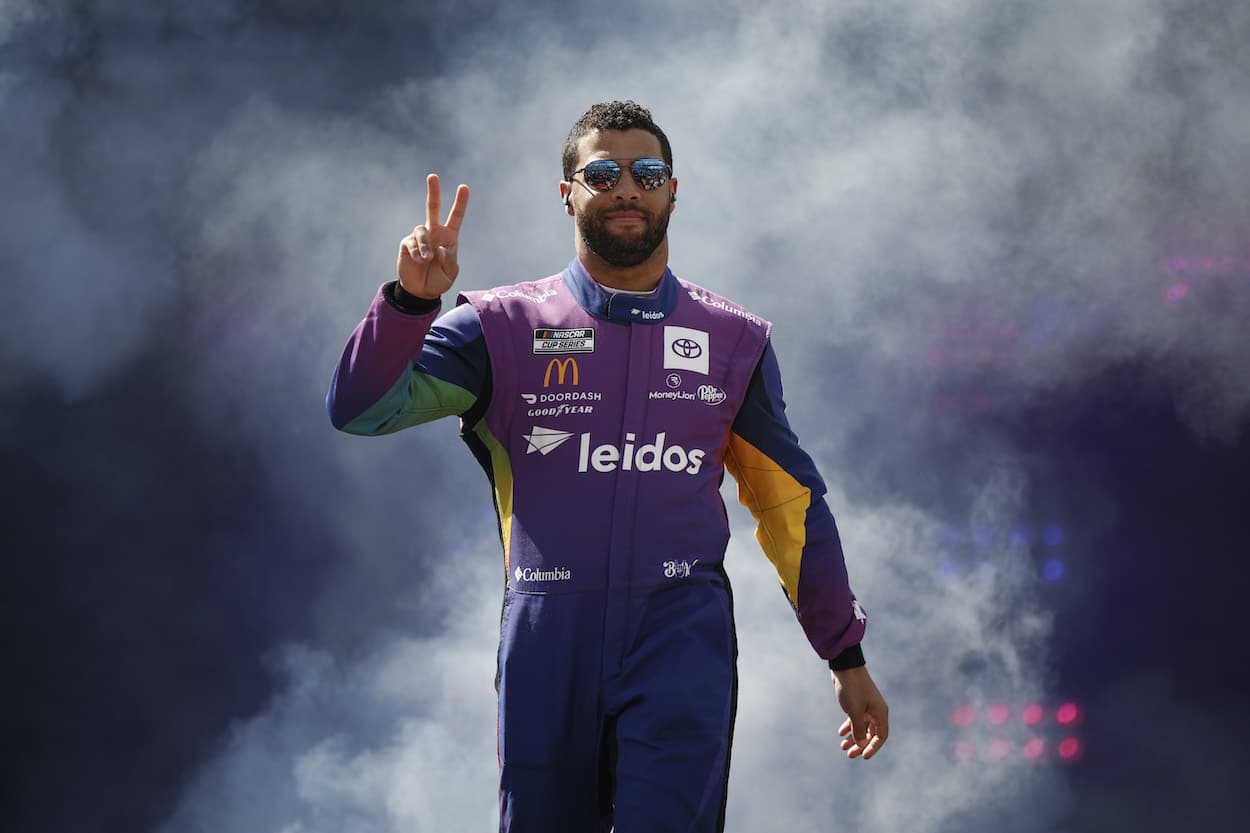 Bubba Wallace waves to crowd.