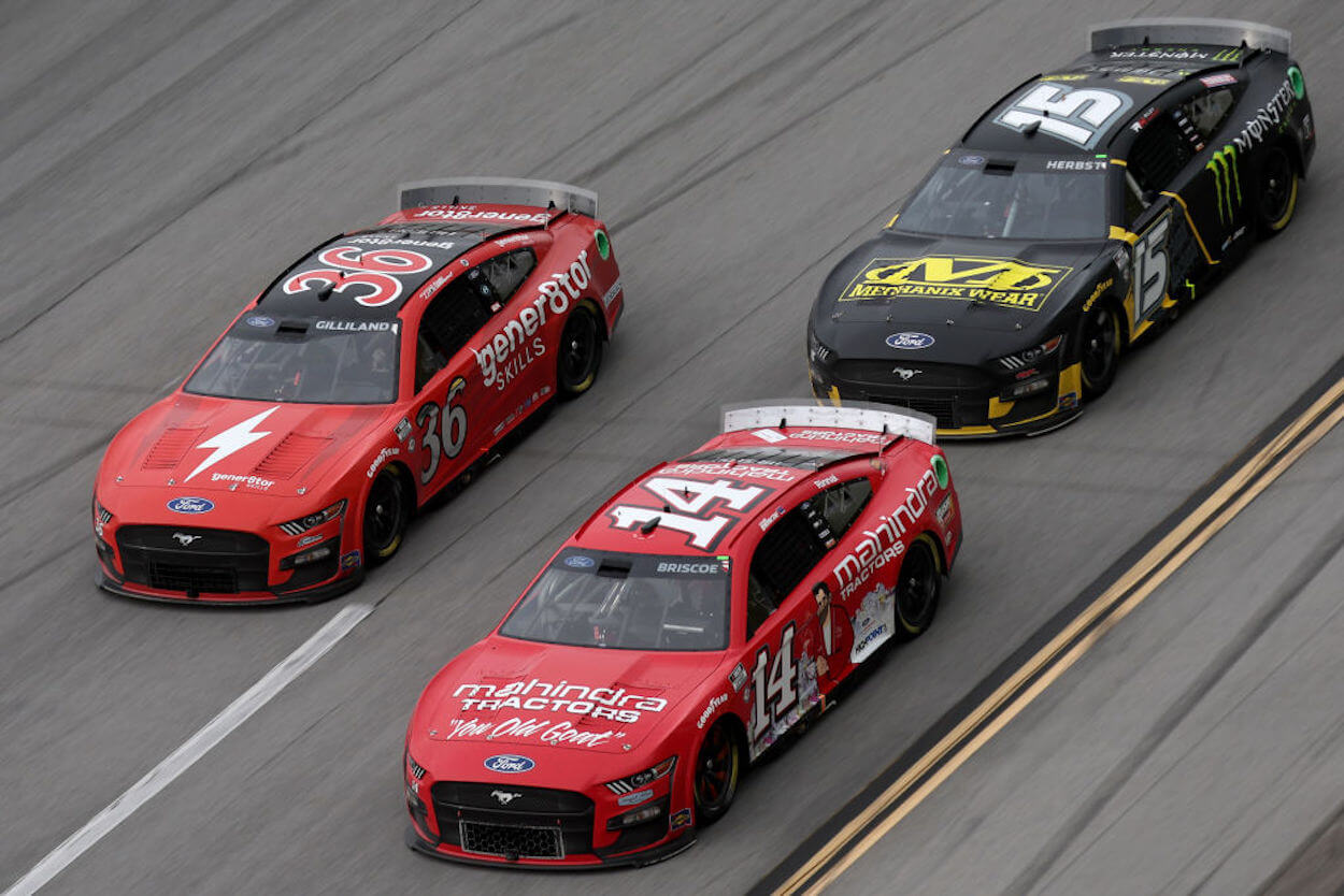Chase Briscoe (R) and Todd Gilliland (L) race side-by-side at Talladega.