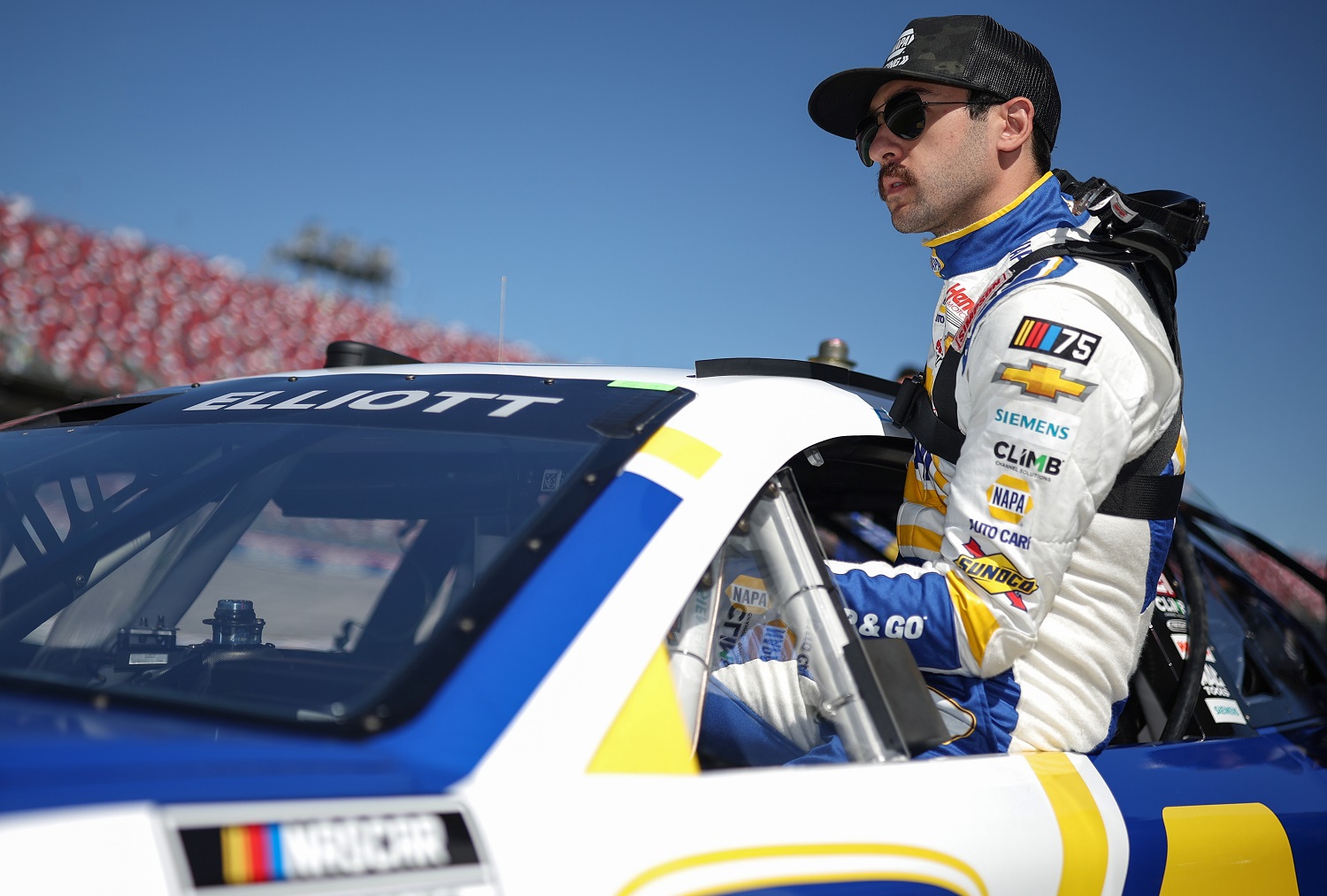 Chase Elliott enters his car during qualifying for the NASCAR Cup Series GEICO 500 at Talladega Superspeedway on April 22, 2023.