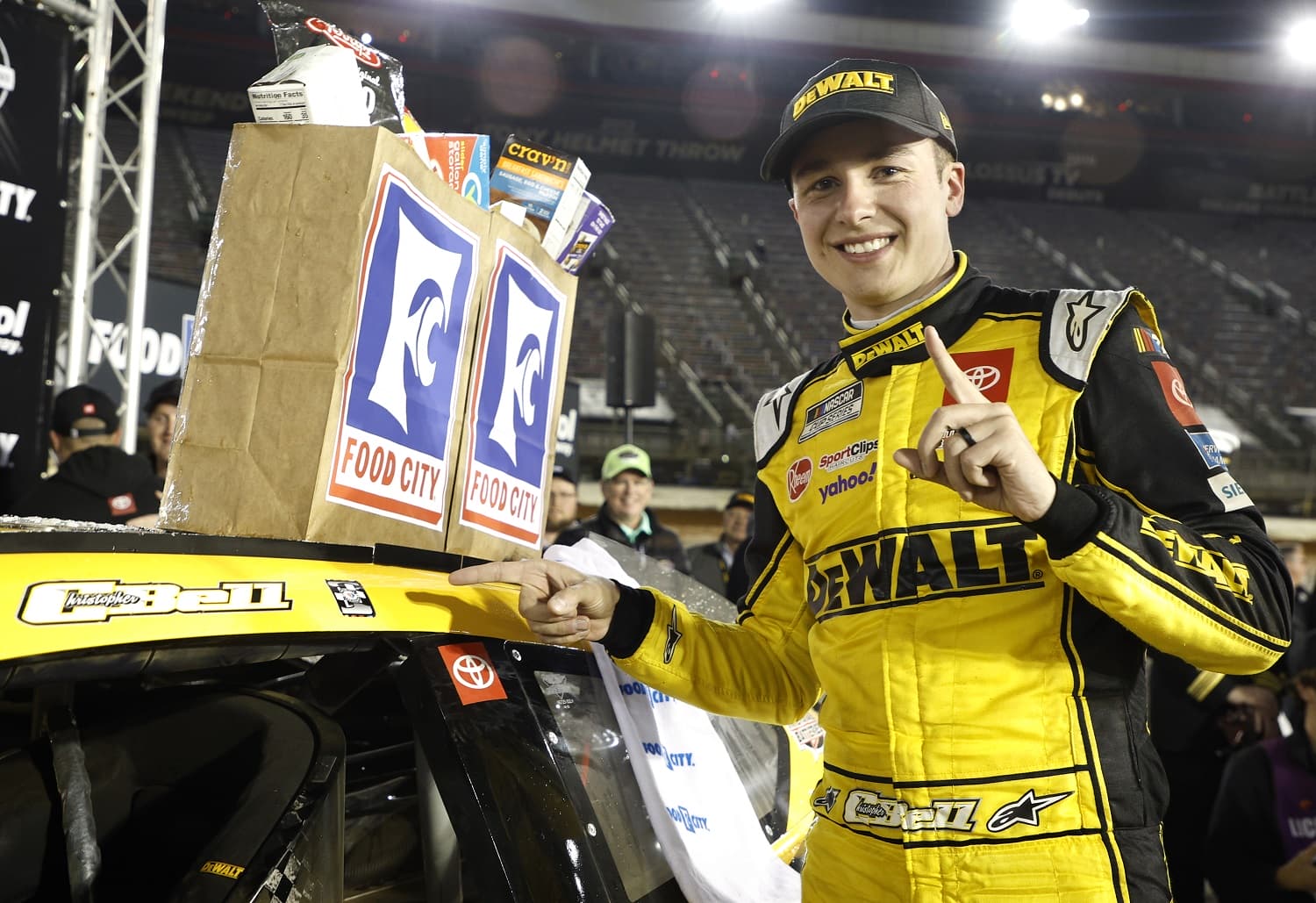 Christopher Bell poses next to his winner sticker after the NASCAR Cup Series Food City Dirt Race at Bristol Motor Speedway on April 9, 2023.