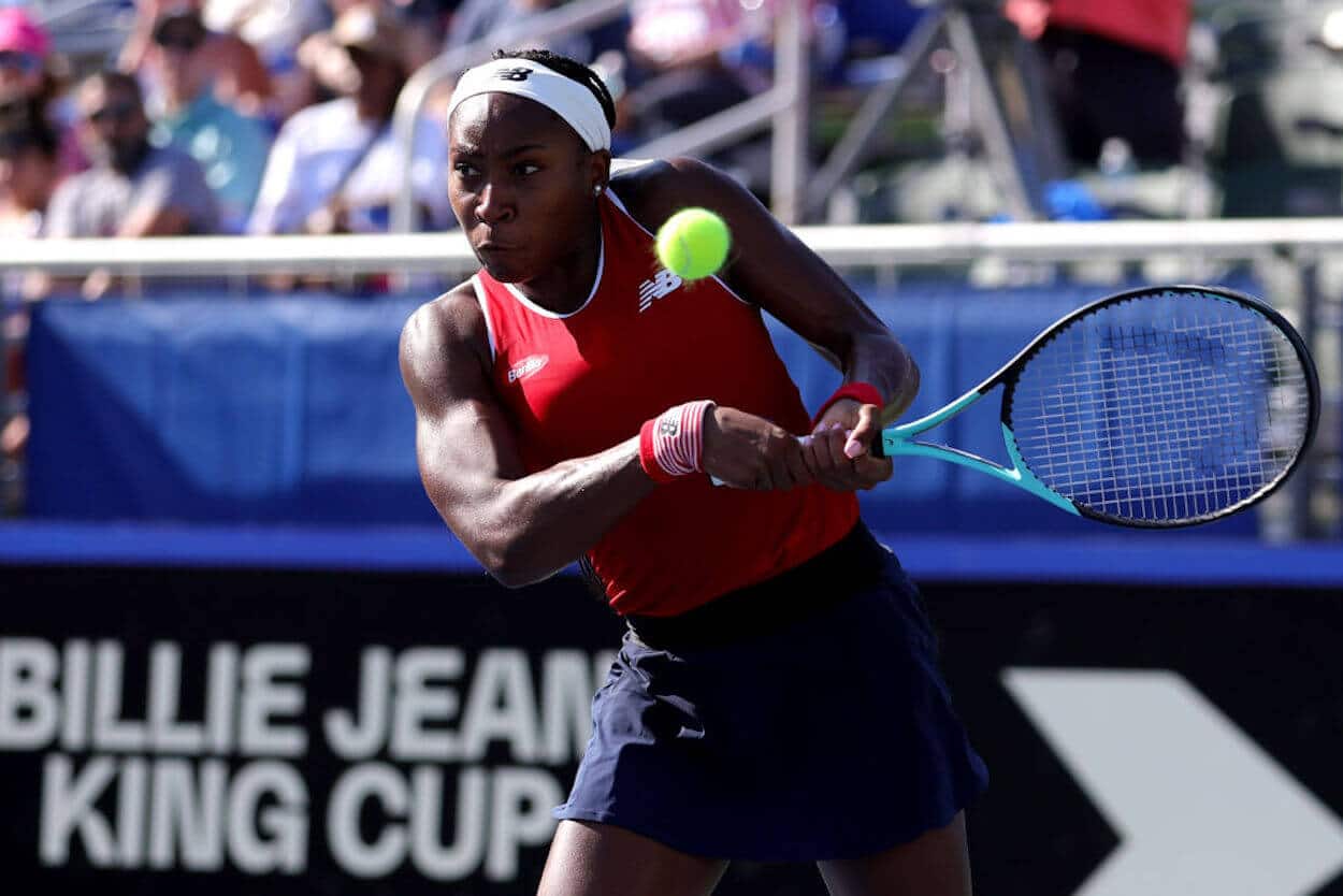 Coco Gauff returns a shot during a 2023 Billie Jean King Cup qualifier.