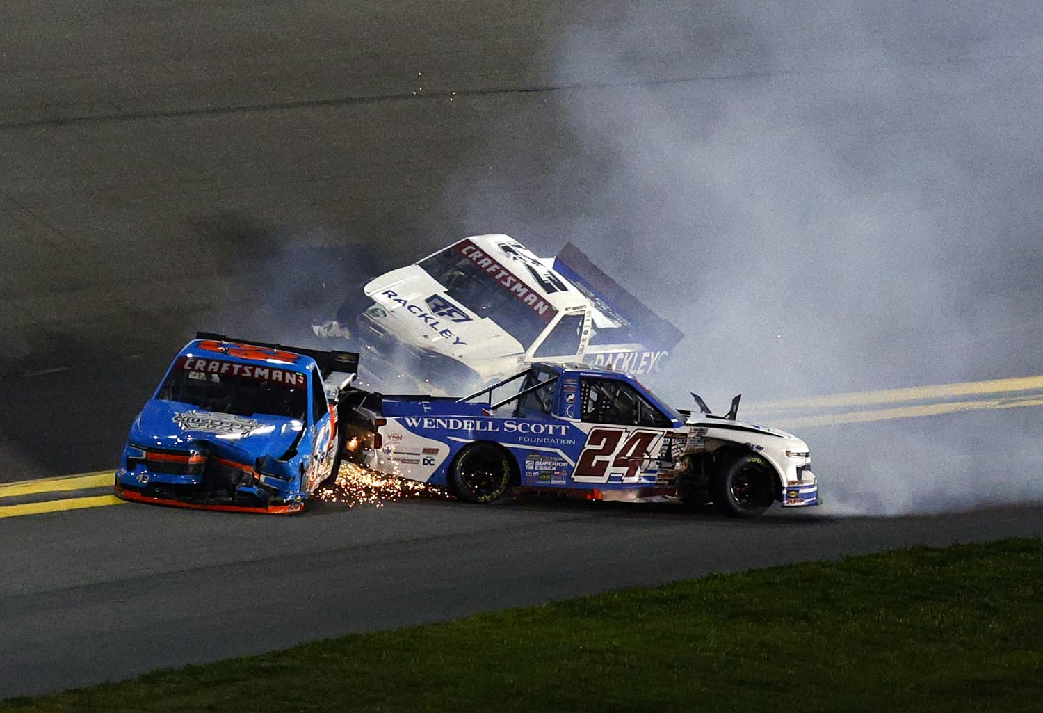Rajah Caruth. Daniel Dye and Matt DiBenedetto spin after an on-track incident during the NASCAR Craftsman Truck Series NextEra Energy 250 at Daytona International Speedway on Feb. 17, 2023.