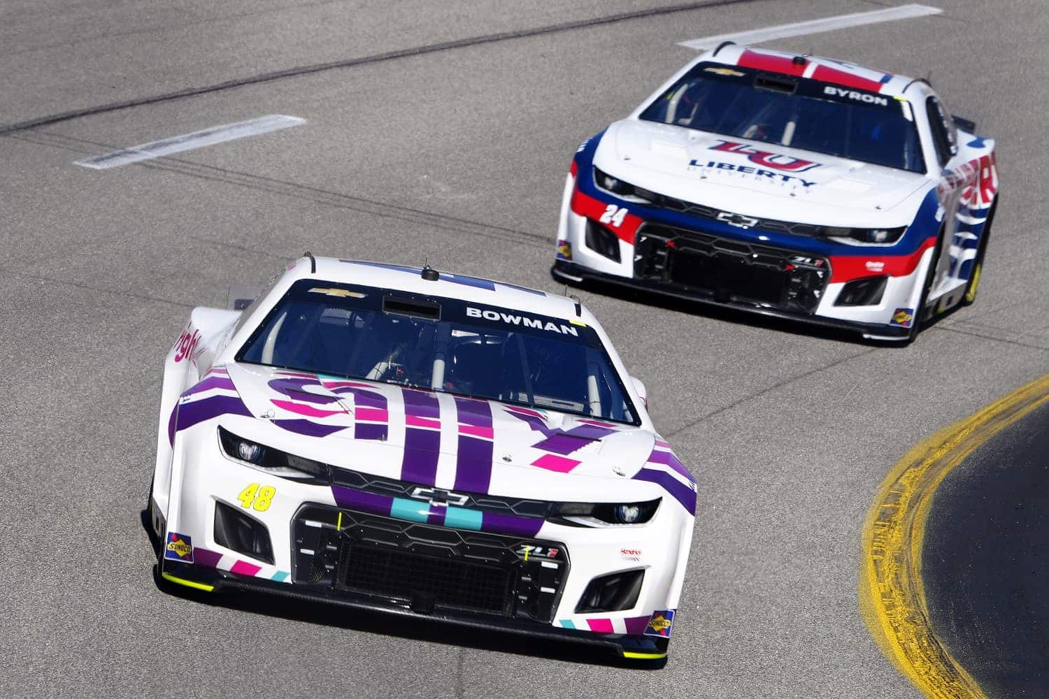 Alex Bowman and William Byron drive during practice for the NASCAR Cup Series Toyota Owners 400 at Richmond Raceway on April 2, 2022.