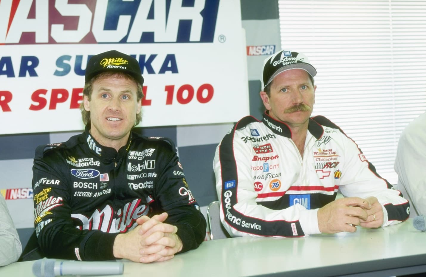 Rusty Wallace and Dale Earnhardt sit at a news conference at the Goodyear Tire Test in Sukaza, Japan, in 1996. | Allsport via Getty Images