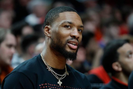 Damian Lillard of the Portland Trail Blazers watches from the bench