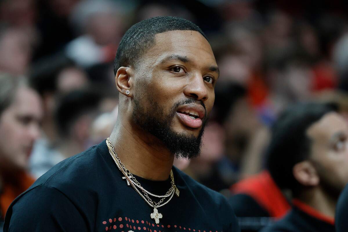 Damian Lillard of the Portland Trail Blazers watches from the bench