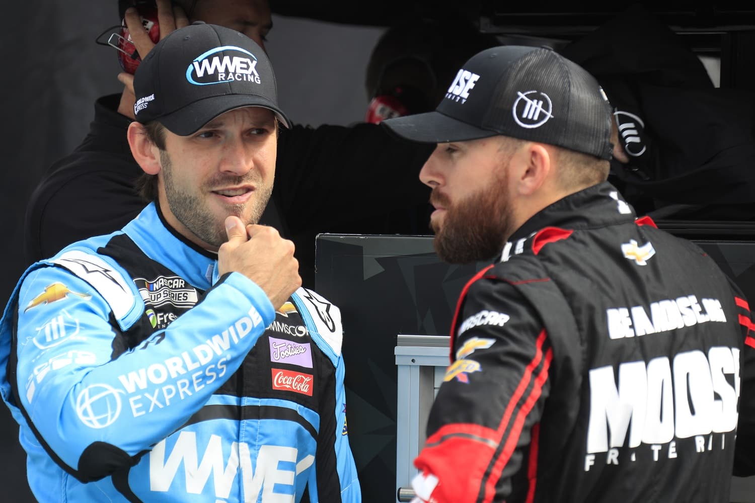 Daniel Suarez talks with teammate Ross Chastain during qualifying for the NASCAR Cup Series Playoff Xfinity 500 on Oct. 29, 2022, at Martinsville Speedway.
