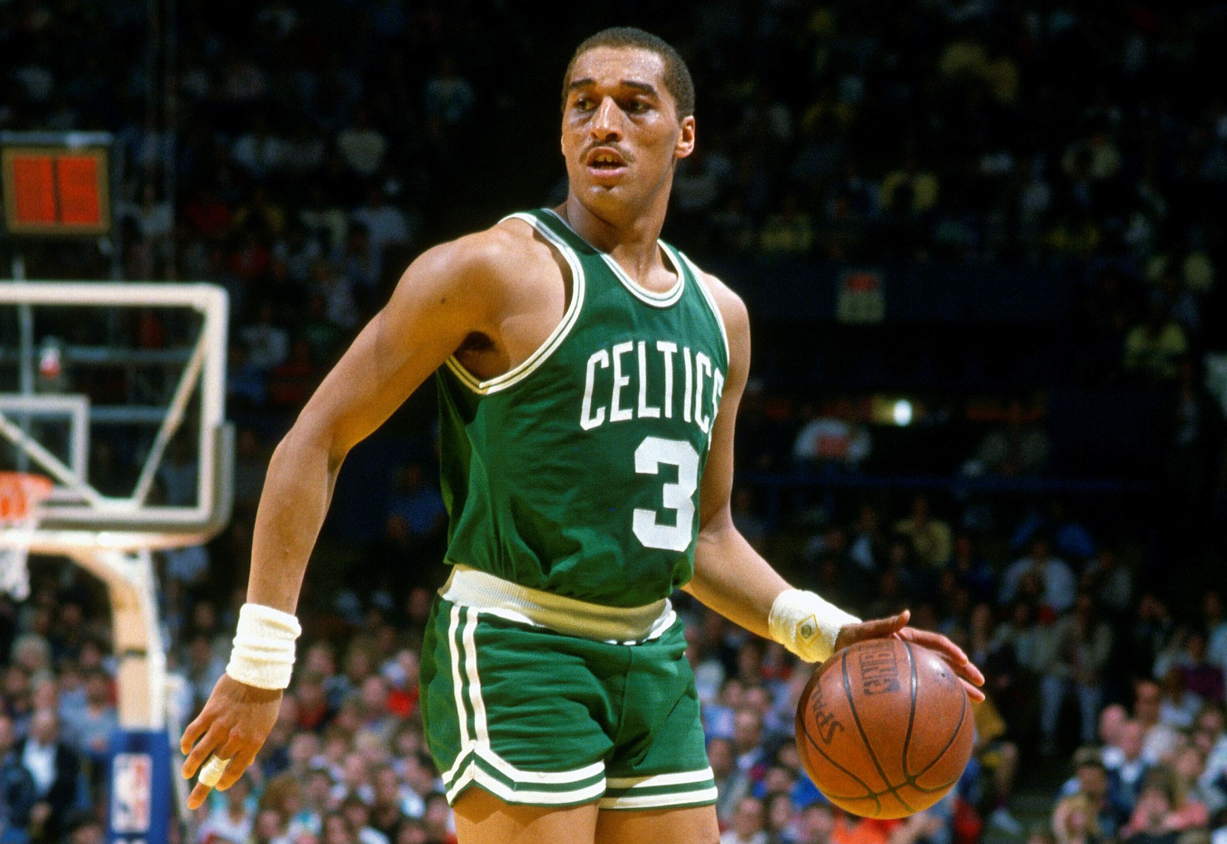Dennis Johnson of the Boston Celtics dribbles the ball against the Milwaukee Bucks.