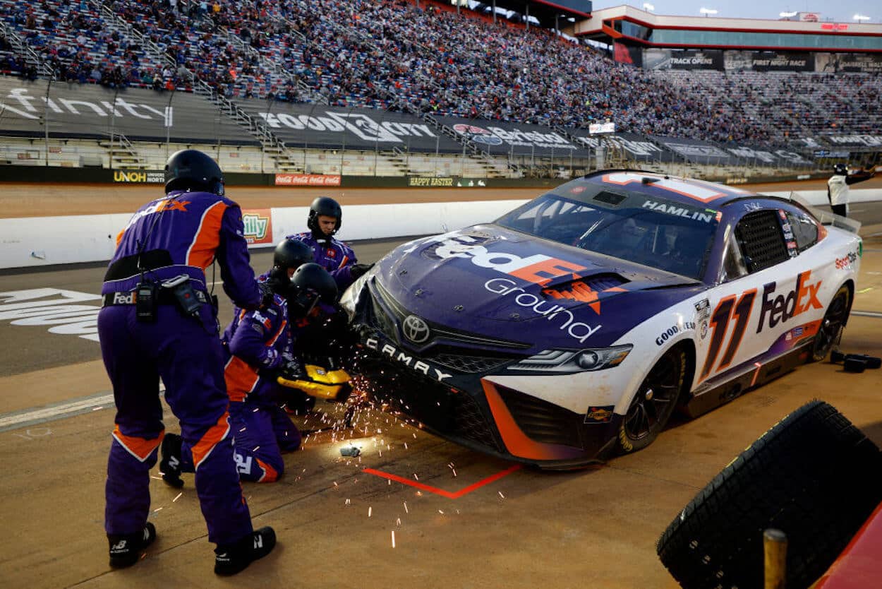 Denny Hamlin's crew works to repair his car at Bristol.