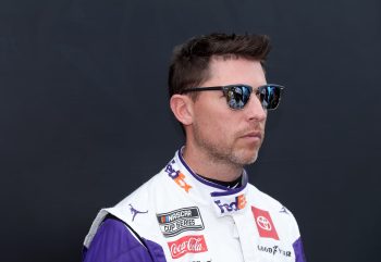 Denny Hamlin waits backstage during ceremonies prior to the Daytona 500 on Feb. 19, 2023.