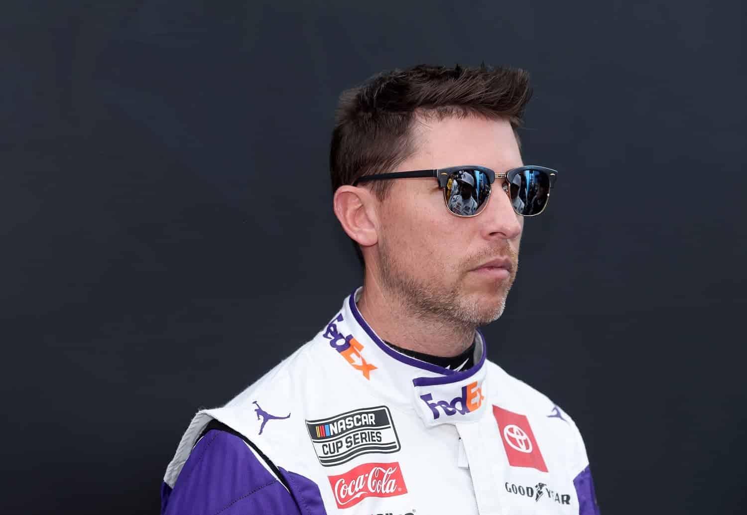 Denny Hamlin waits backstage during ceremonies prior to the Daytona 500 on Feb. 19, 2023.