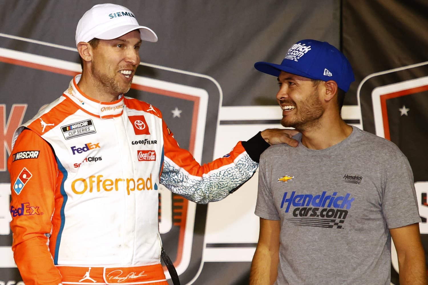 Drivers Denny Hamlin and Kyle Larson speak on Victory Lane after winning the NASCAR Cup Series Cook Out Southern 500 at Darlington Raceway on Sept. 5, 2021.