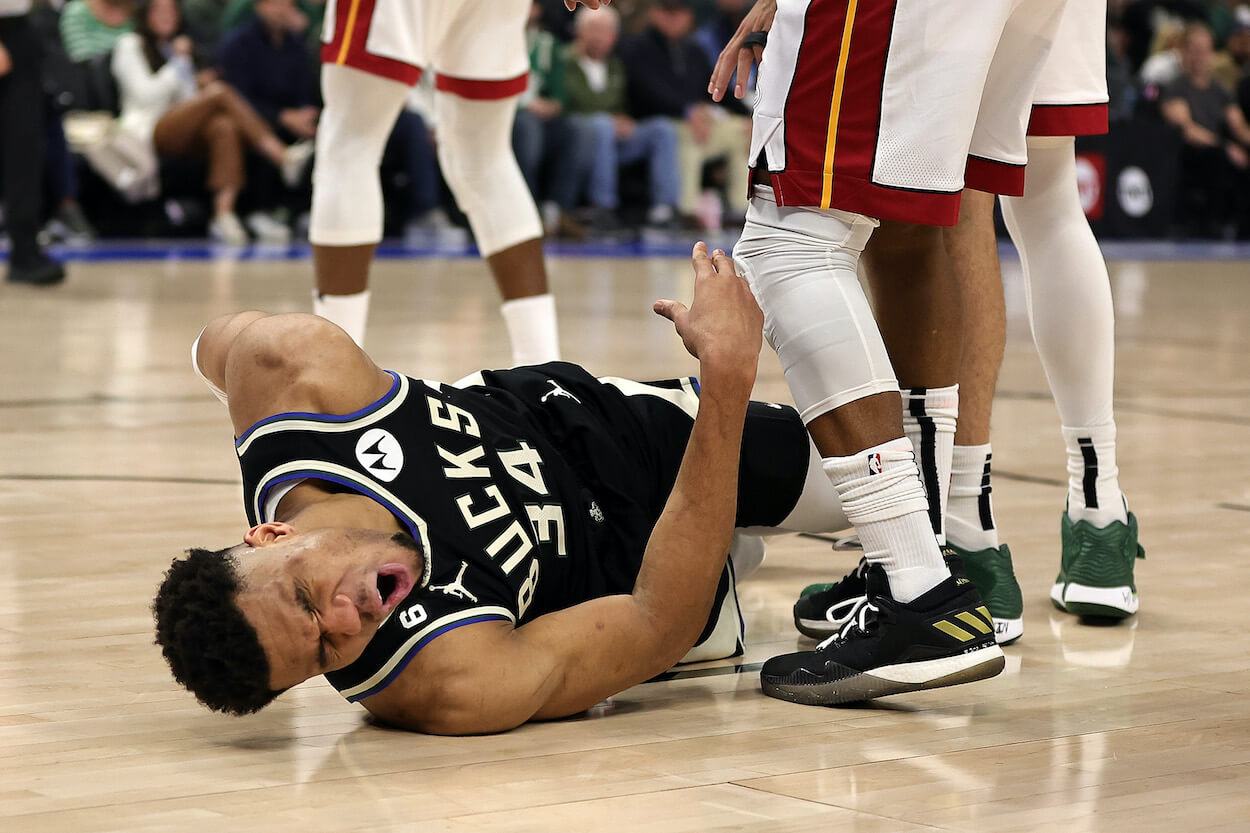 Giannis Antetokounmpo falls to the ground against the Miami Heat.
