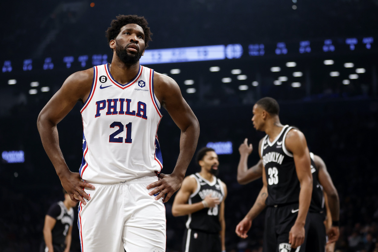 Joel Embiid looks on during a playoff game against the Nets.