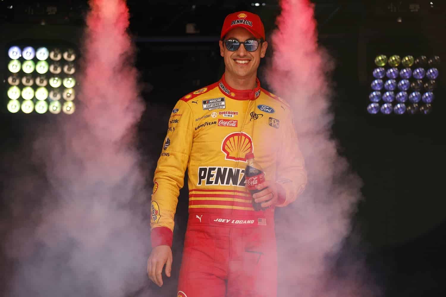 Joey Logano walks onstage during driver intros for the NASCAR Cup Series Food City Dirt Race at Bristol Motor Speedway on April 9, 2023.