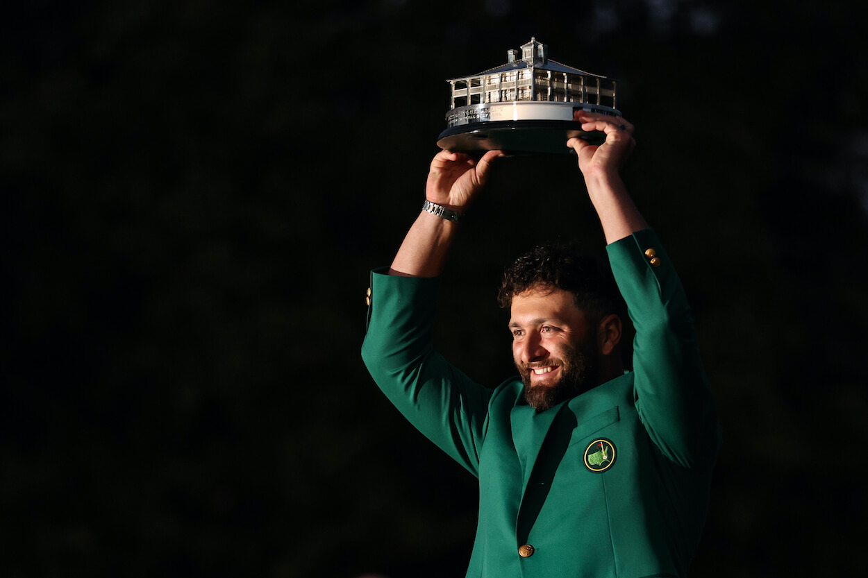 Jon Rahm celebrates with the green jacket after winning the 2023 Masters.