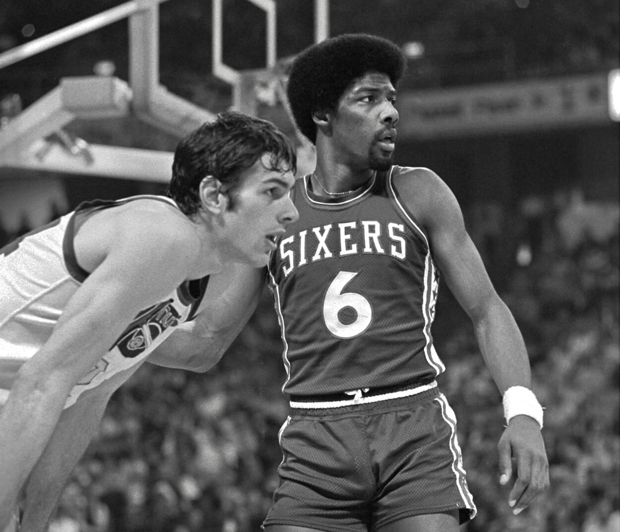 Philadelphia 76ers forward Julius Erving guards Denver Nuggets forward Bobby Jones.