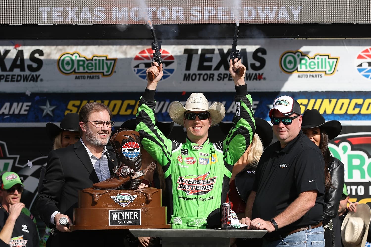 Kyle Busch celebrates in Victory Lane after winning the Monster Energy NASCAR Cup Series O'Reilly Auto Parts 500 at Texas Motor Speedway on April 8, 2018. | Chris Graythen/Getty Images