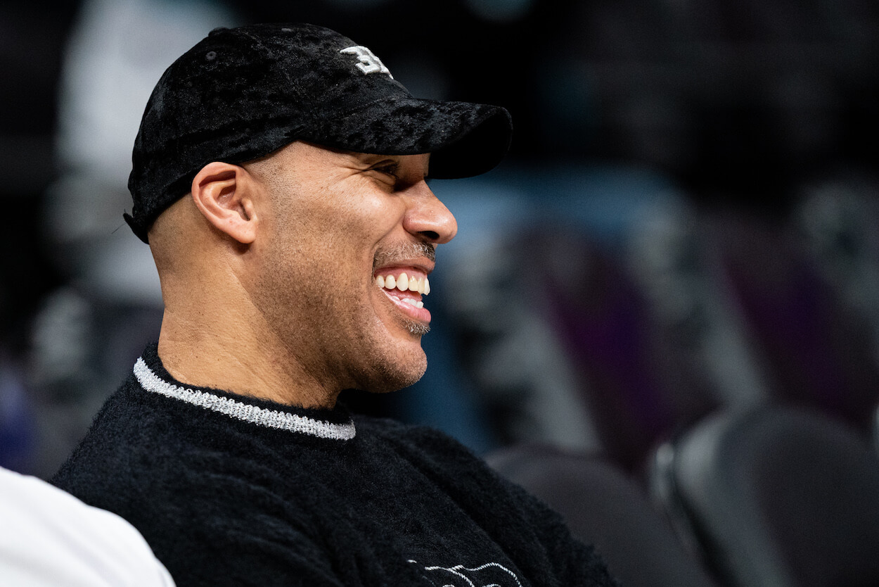 LaVar Ball laughs during a Charlotte Hornets game.