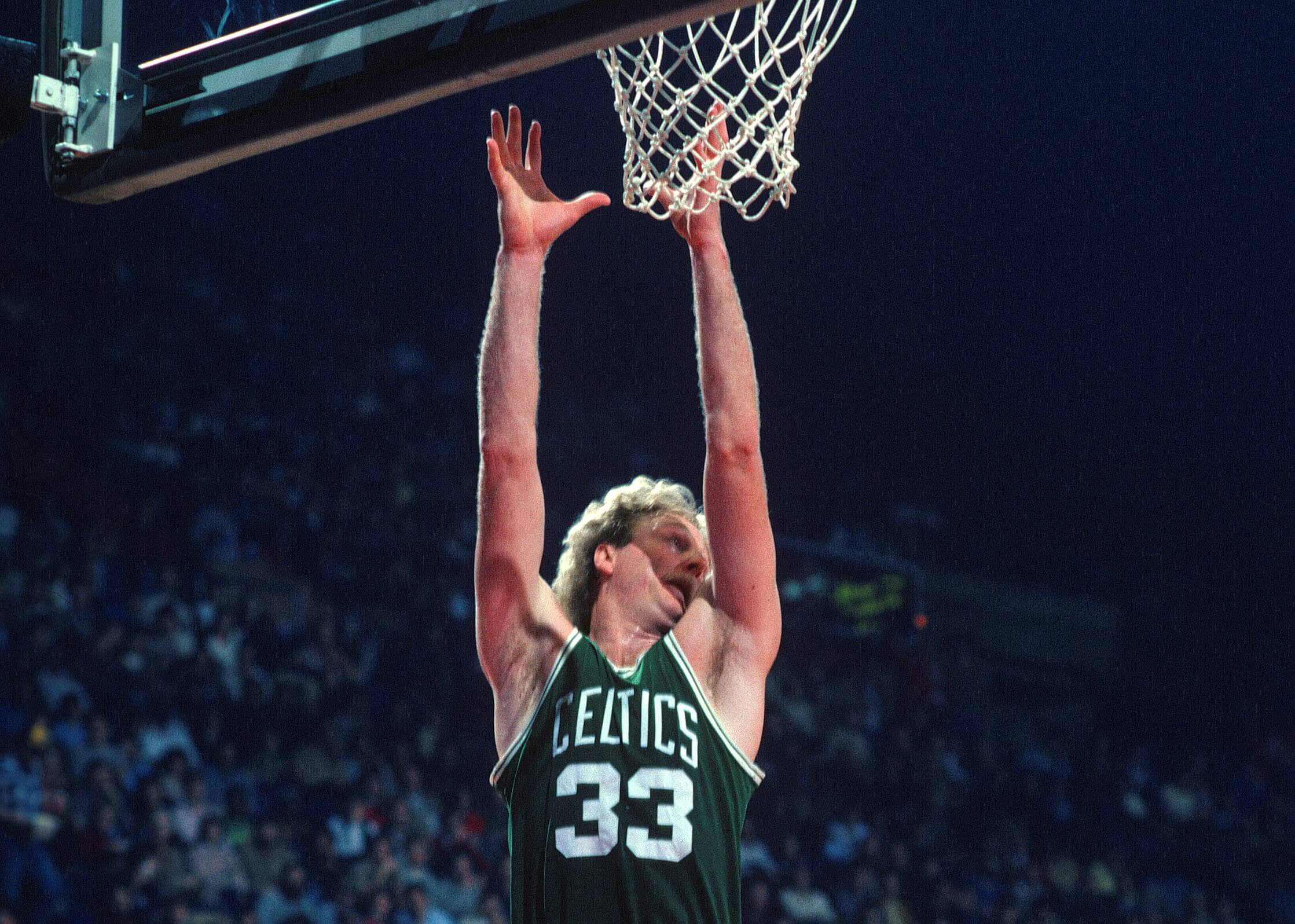 Larry Bird of the Boston Celtics goes up to grab a rebound.