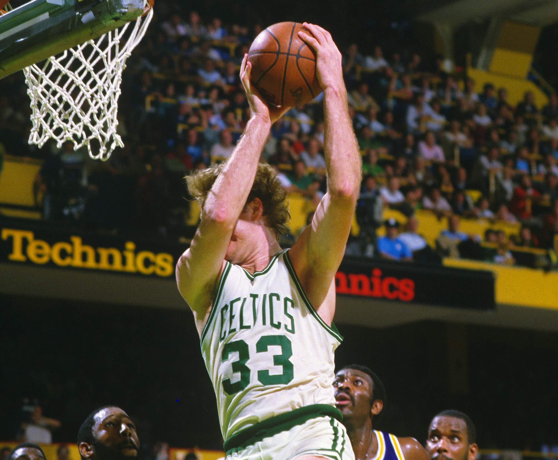 Larry Bird of the Boston Celtics pulls down a rebound.