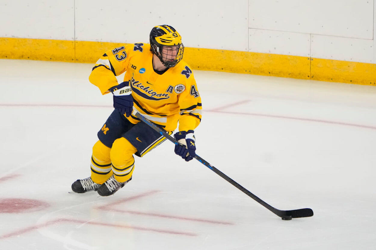 Luke Hughes in action for the University of Michigan.