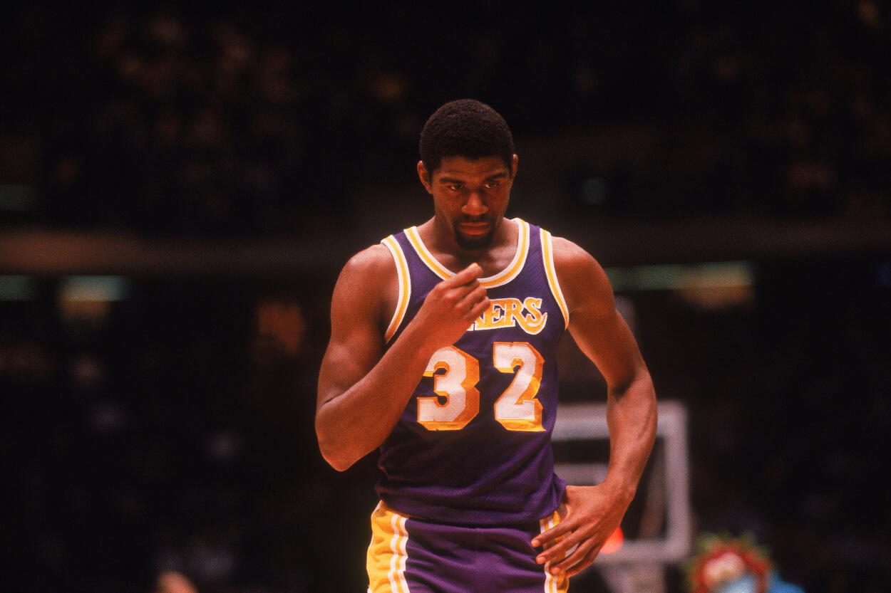 Magic Johnson of the Los Angeles Lakers walks on the court.