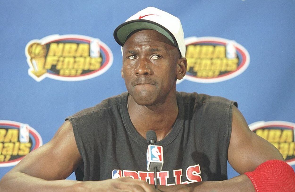 Michael Jordan reacts to a question during an NBA Finals press conference.