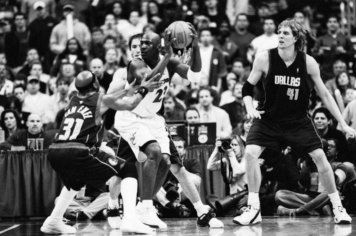 Michael Jordan (C) and Dirk Nowitzki (R) in NBA action.