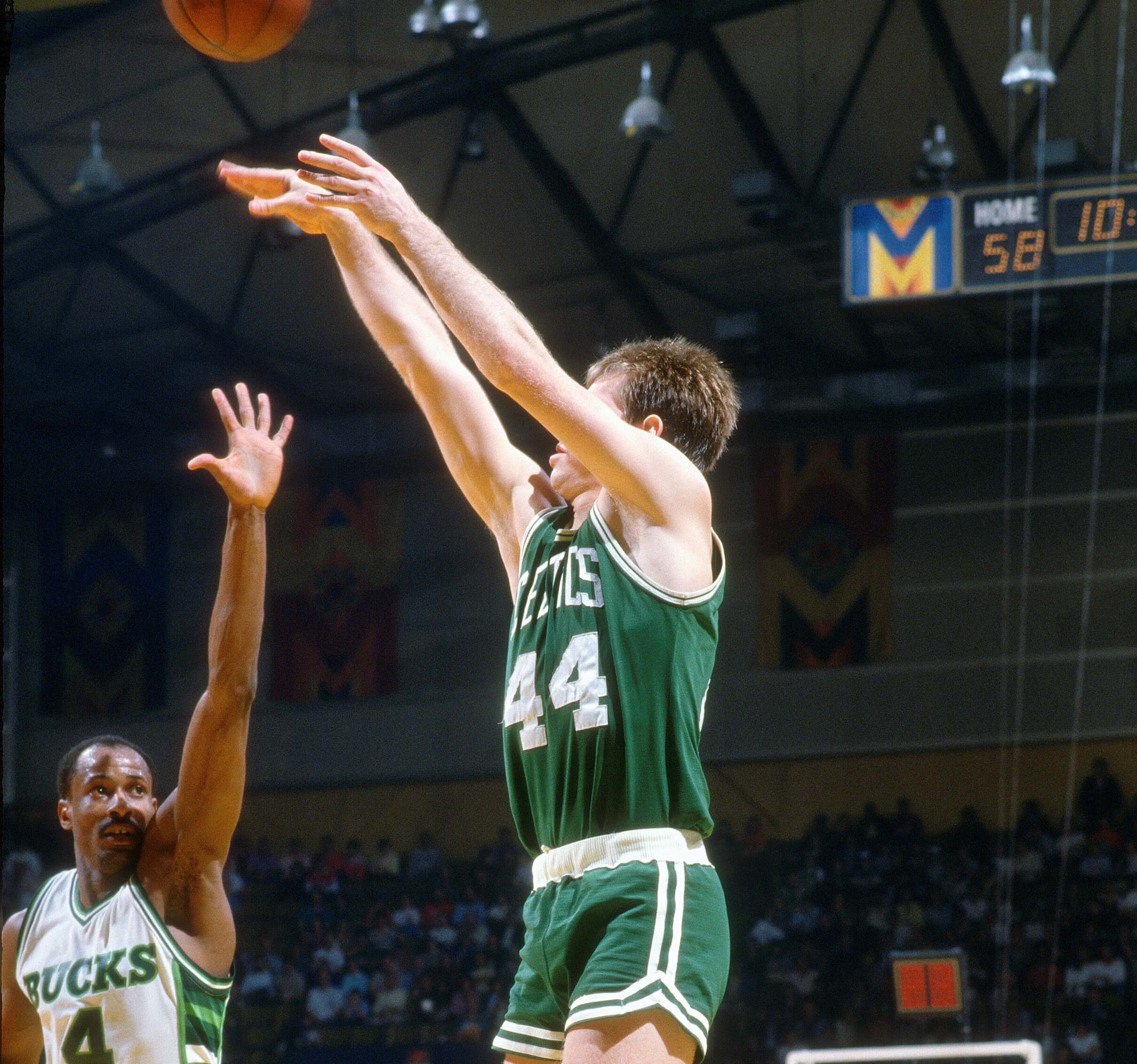 Danny Ainge of the Boston Celtics shoots over Sidney Moncrief of the Milwaukee Bucks.