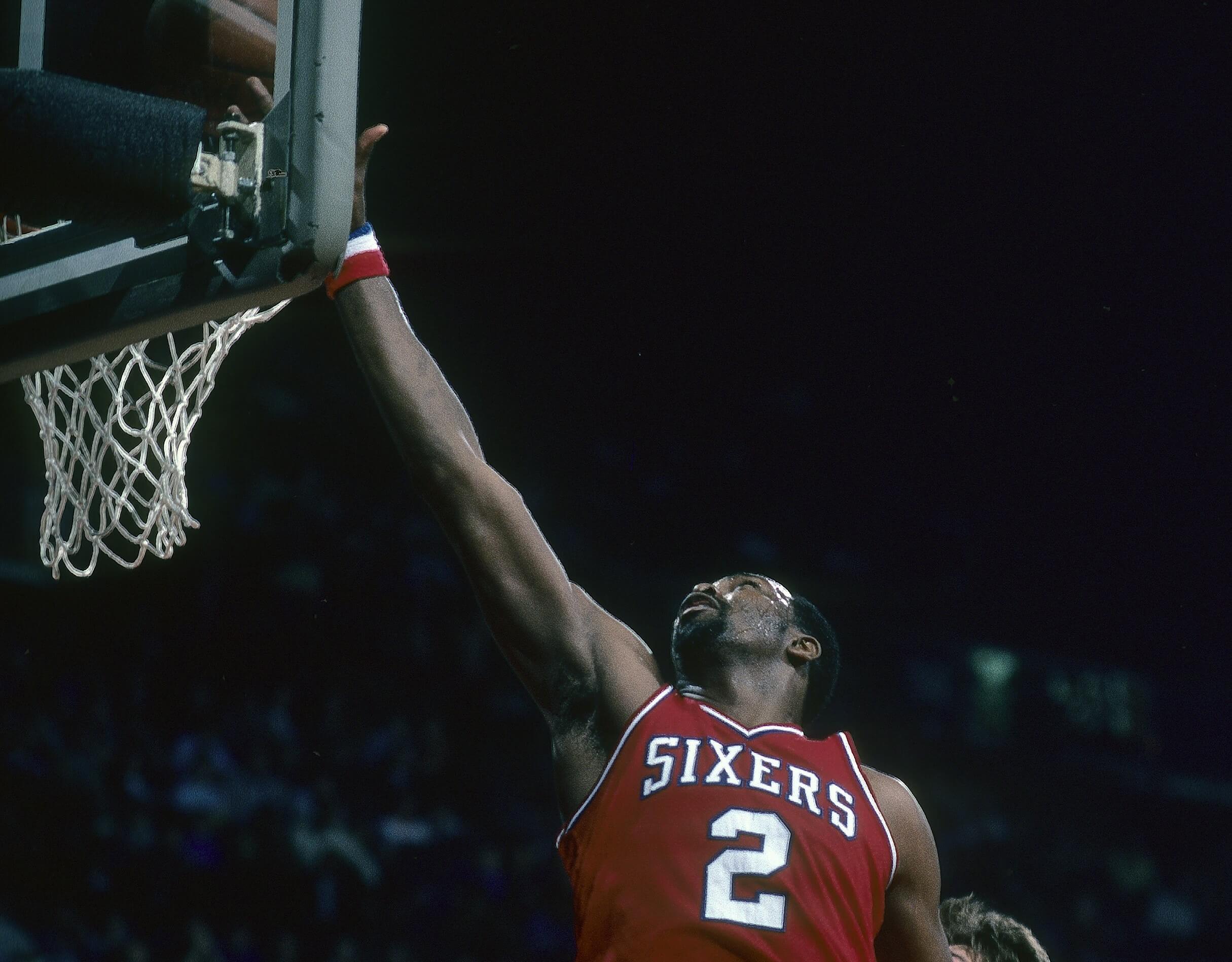 Moses Malone of the Philadelphia 76ers lays the ball up for two points.