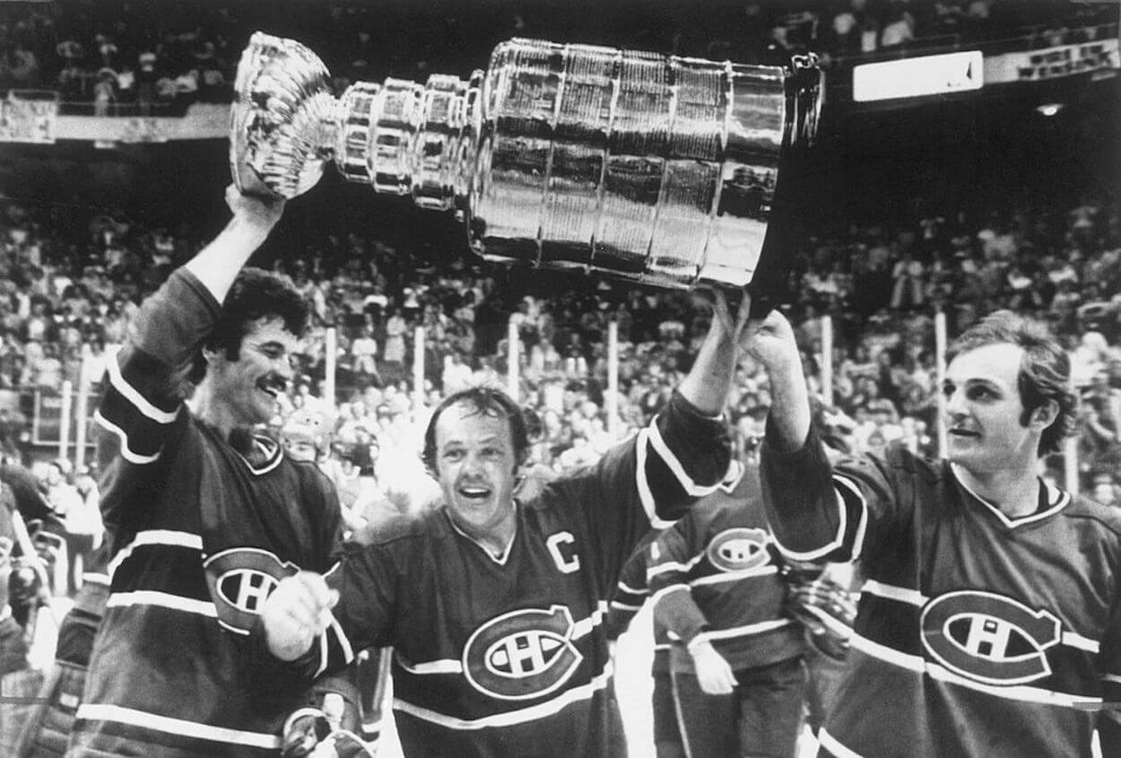 Yvan Cournoyer (C) lifts the Stanley Cup in 1978.