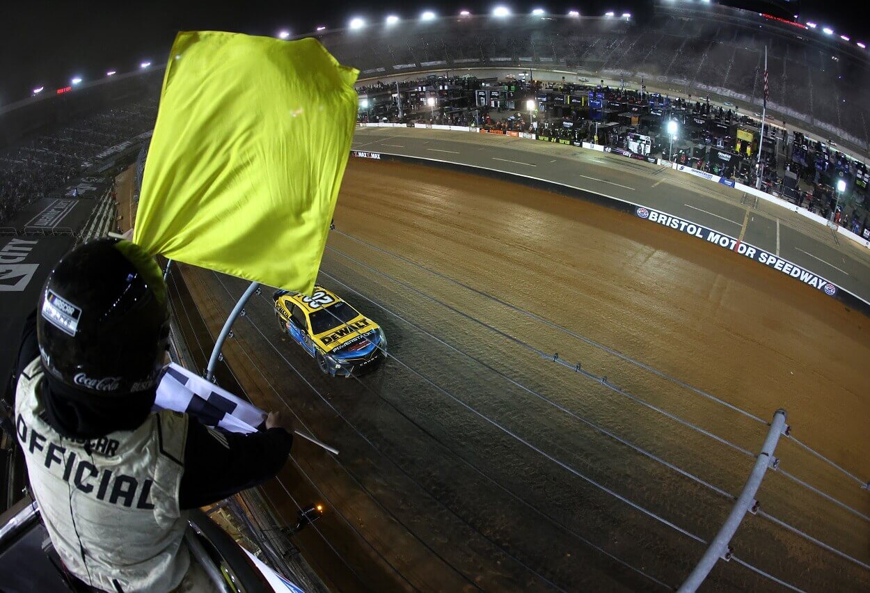 Christopher Bell takes the checkered flag under caution to win the NASCAR Cup Series Food City Dirt Race at Bristol Motor Speedway on April 09, 2023