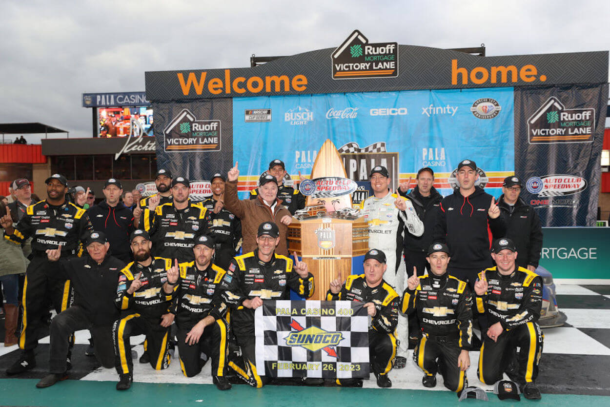 Kyle Busch, his crew, and RCR owner Richard Childress celebrate victory at Fontana.