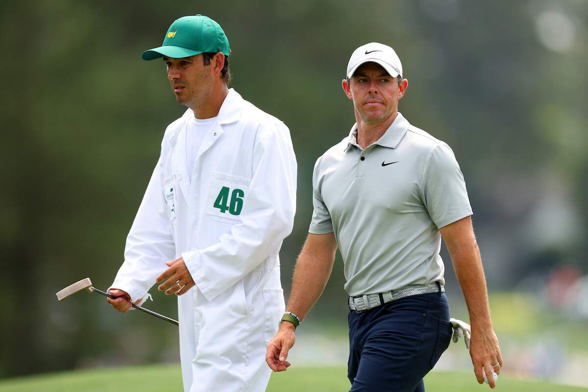 Golfer Rory McIlroy and his caddie Harry Diamond react during the second round of the 2023 Masters Tournament at Augusta National Golf Club