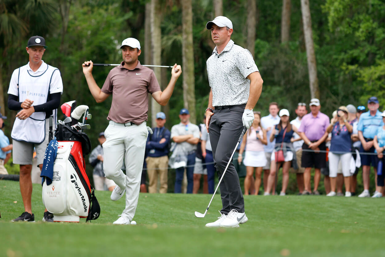 Rory McIlroy and Scottie Scheffler look on during the 2023 Players Championship.