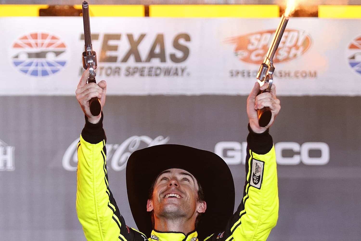 Ryan Blaney celebrates by shooting guns in Victory Lane after winning the NASCAR Cup Series All-Star Race at Texas Motor Speedway on May 22, 2022.
