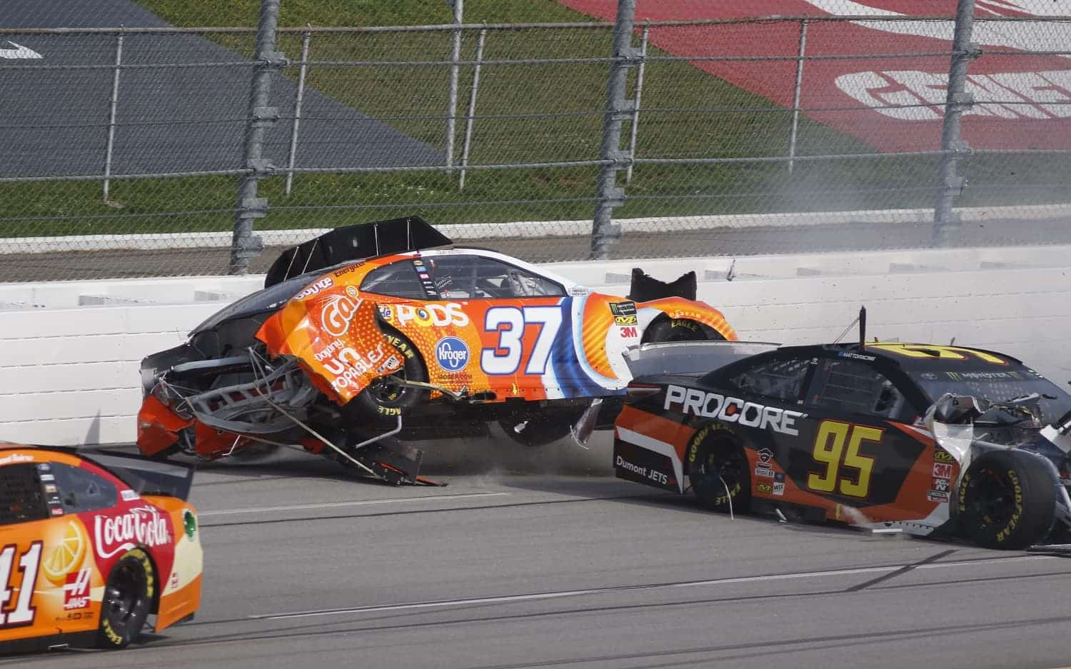 Chris Buescher (37) and Matt DiBenedetto (95) wreck during the GEICO 500 on April 28, 2019, at Talladega Superspeedway.