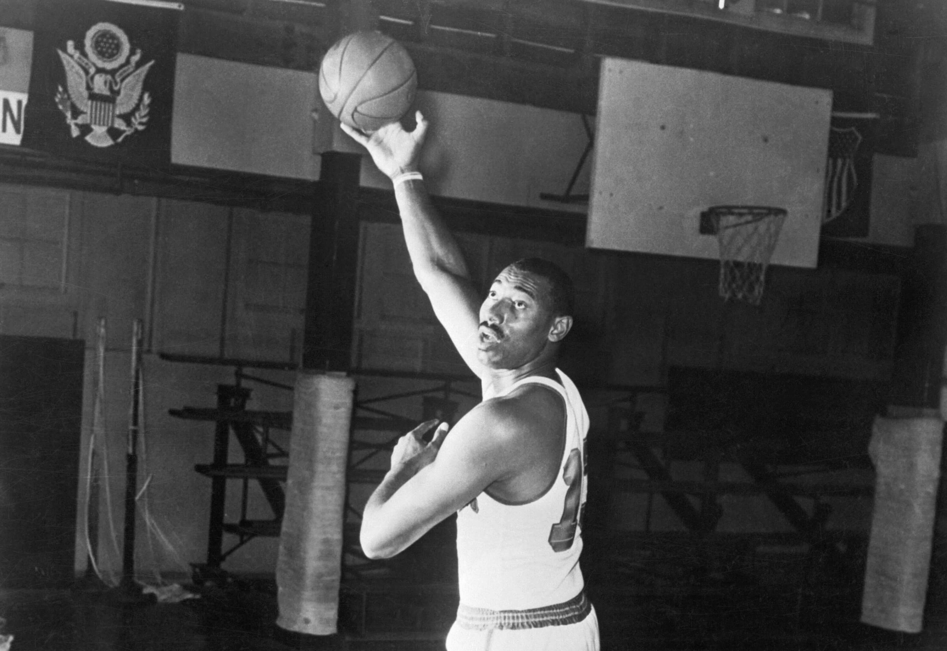 Wilt Chamberlain of the San Francisco Warriors takes a hook shot.