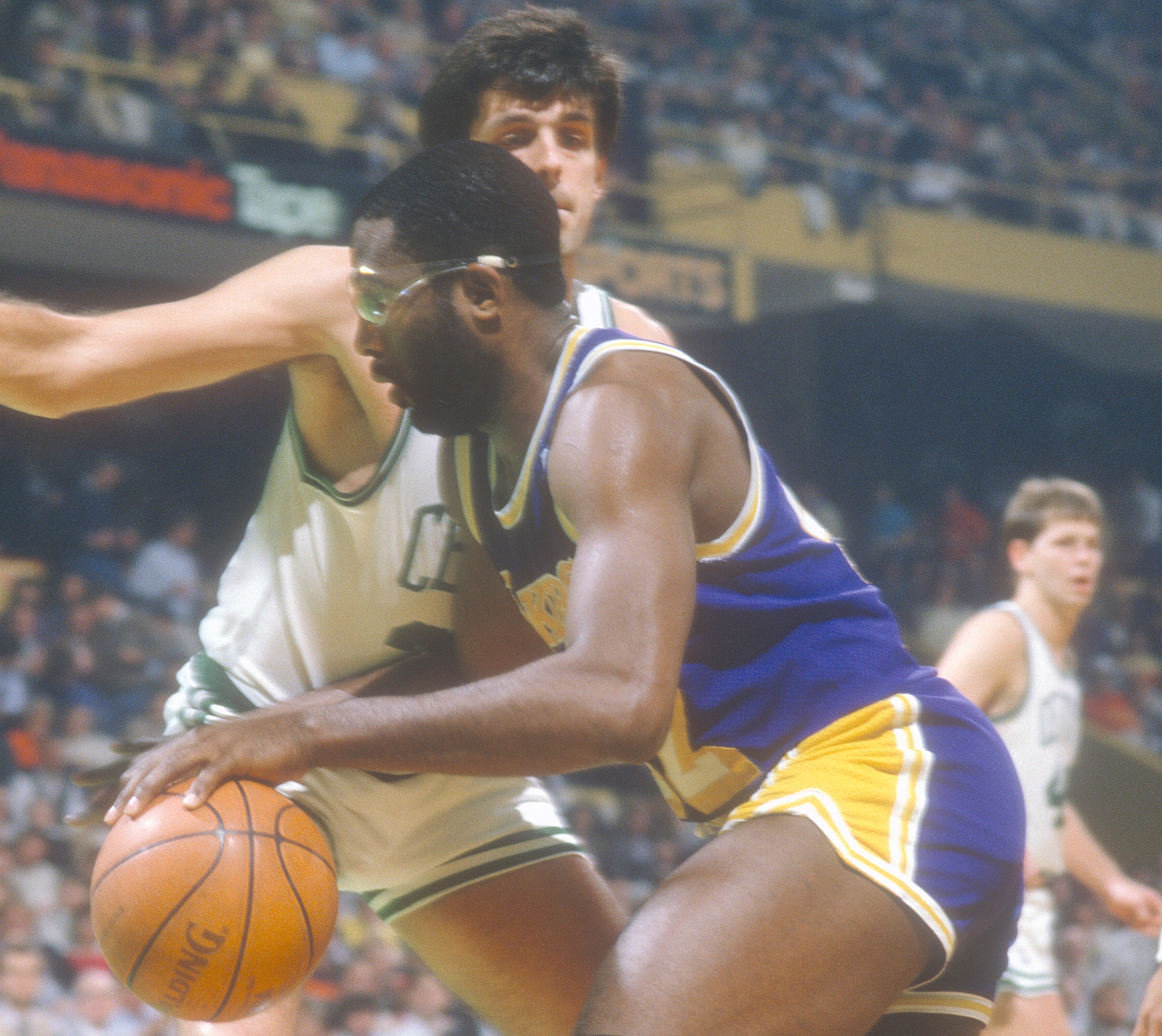 James Worthy of the Los Angeles Lakers drives on Kevin McHale of the Boston Celtics.