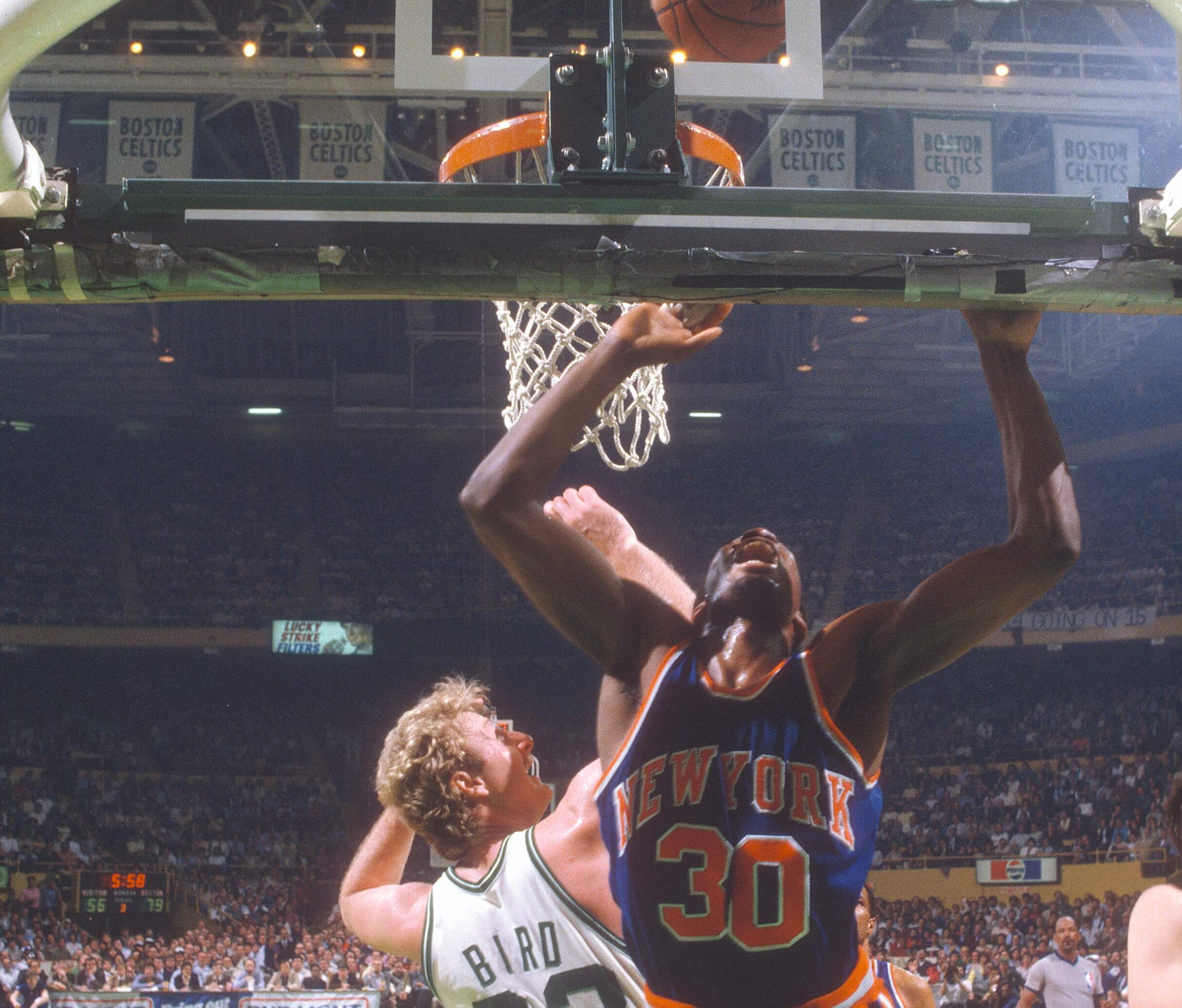 Bernard King of the New York Knicks in action against Larry Bird of the Boston Celtics.