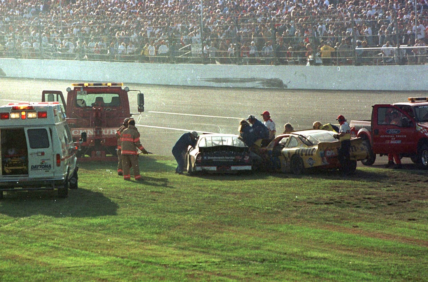 Emergency workers arrive at Dale Earnhardt's No. 3 Chevrolet after the crash on the final lap of the 43rd Daytona 500 on Feb. 18, 2001. | Marc Serota/Liaison via Getty Images