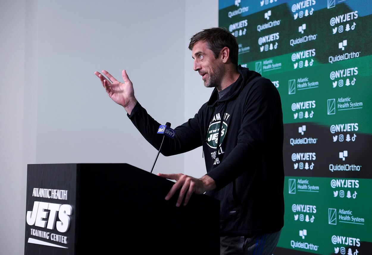 Aaron Rodgers #8 of the New York Jets answers questions after an offseason workout session at Atlantic Health Jets Training Center on May 23, 2023