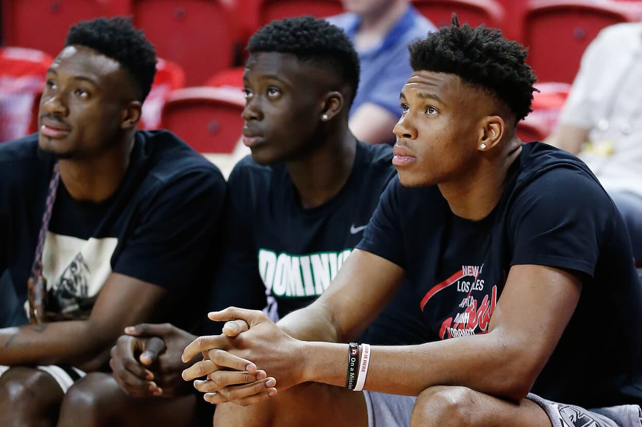 Thanasis Antetokounmpo, Francis Antetokounmpo, and Giannis Antetokounmpo look on.