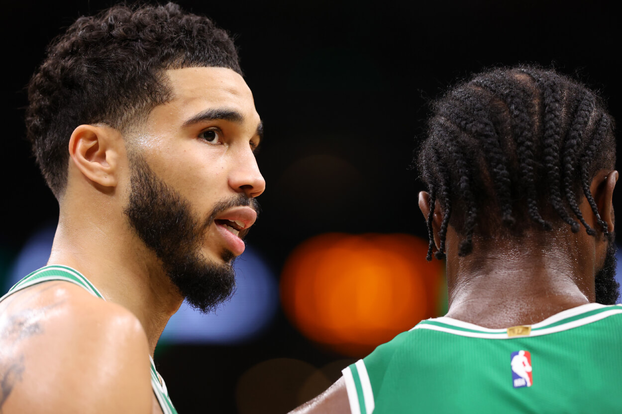 Jayson Tatum of the Boston Celtics talks to Jaylen Brown during the third quarter against the Miami Heat.