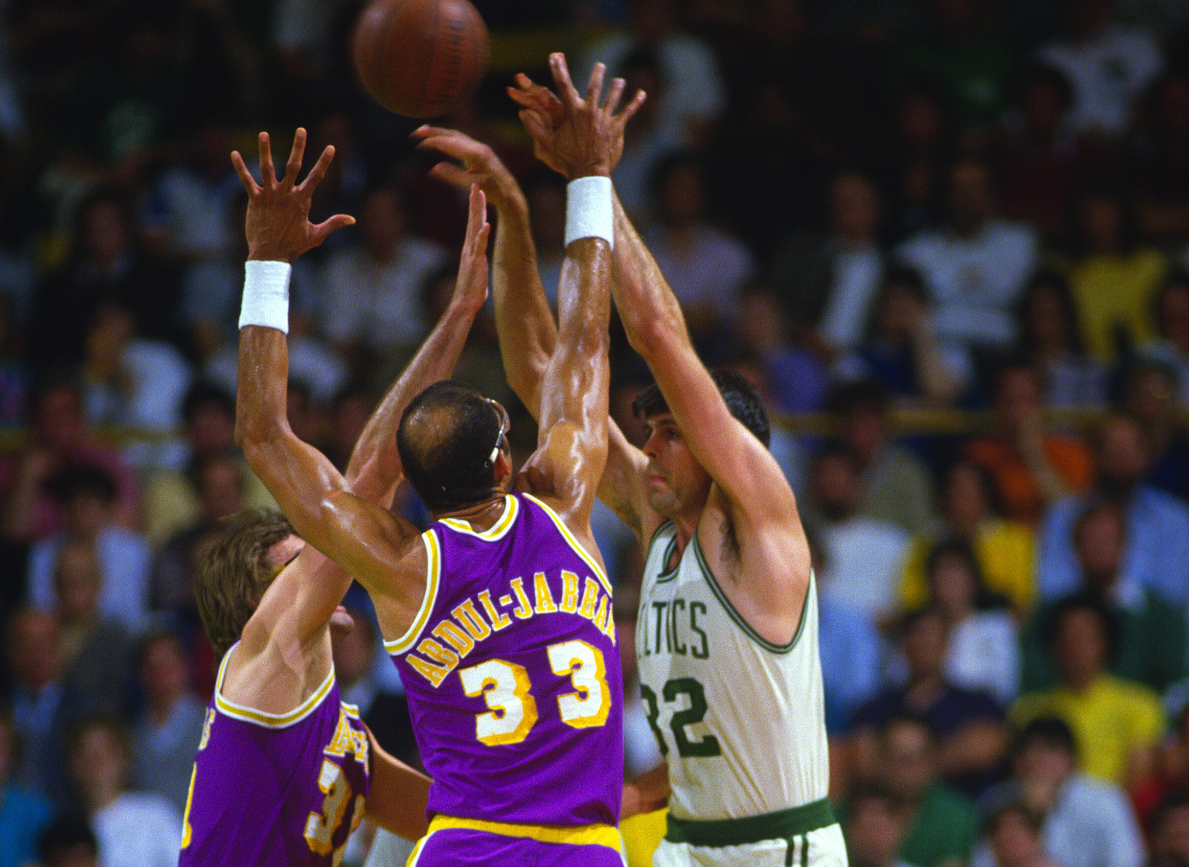 Kareem Abdul-Jabbar of the Los Angeles Lakers guards Kevin McHale of the Boston Celtics.