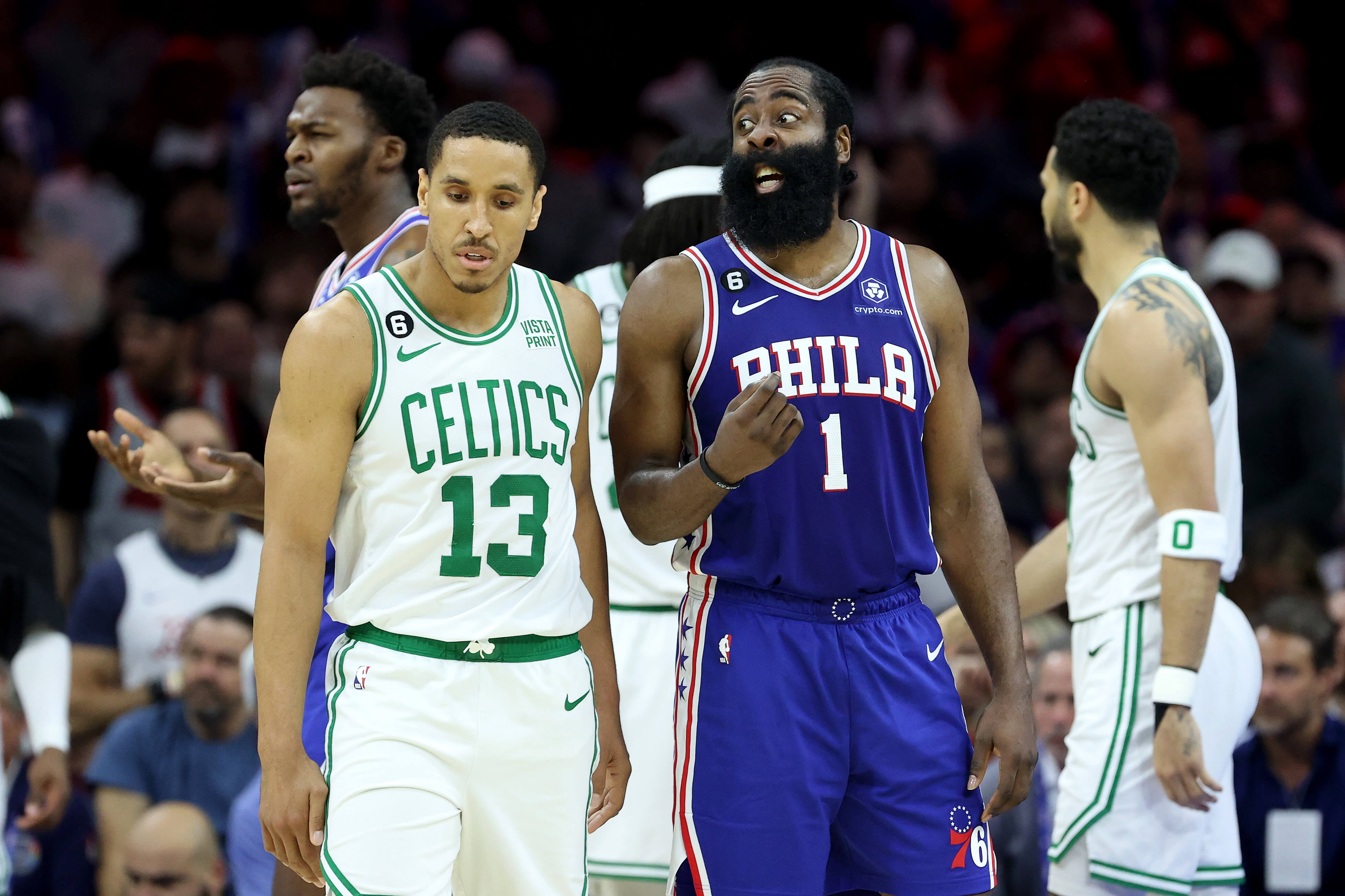 James Harden of the Philadelphia 76ers reacts against Malcolm Brogdon of the Boston Celtics.