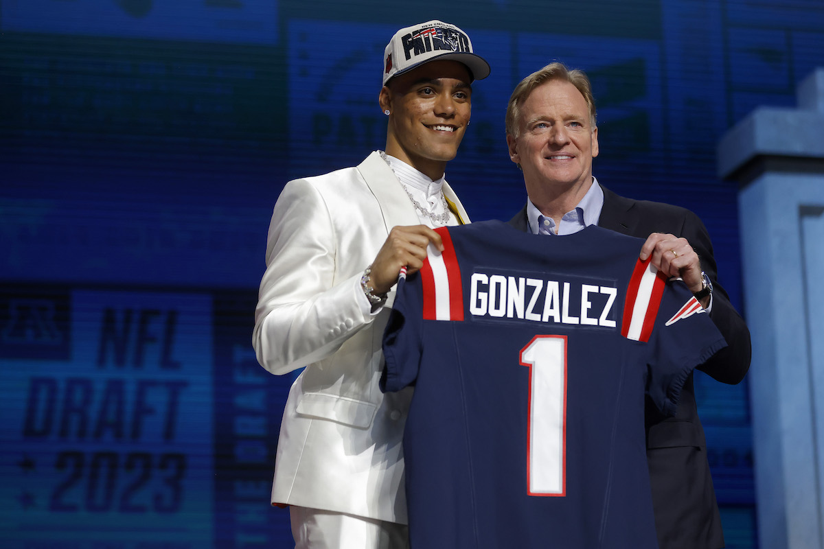 Christian Gonzalez poses with Roger Goodell