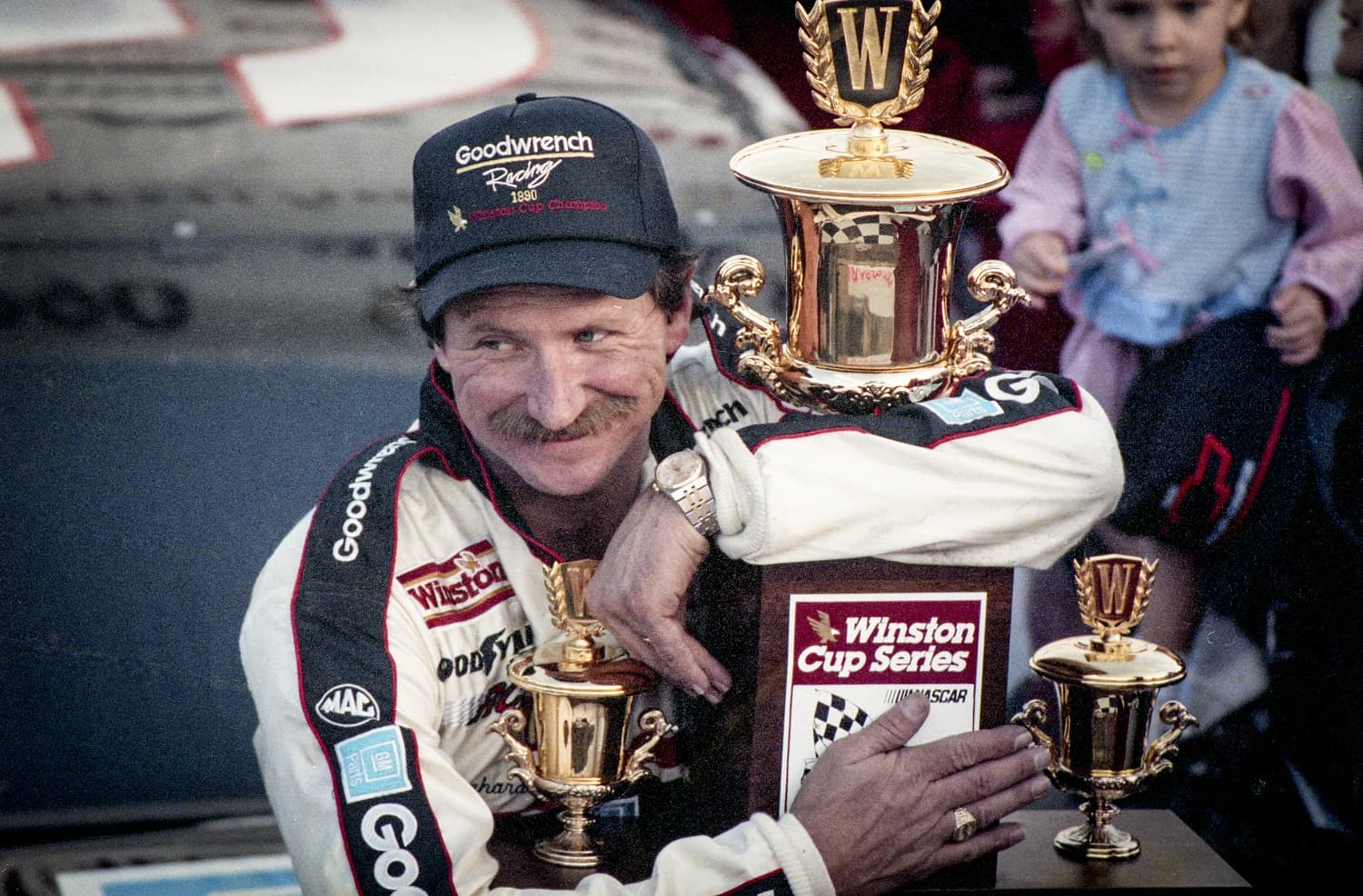 Dale Earnhardt celebrates his fourth NASCAR Cup Series championship after the Atlanta Journal 500 at Atlanta Motor Speedway on Nov. 18, 1990.
