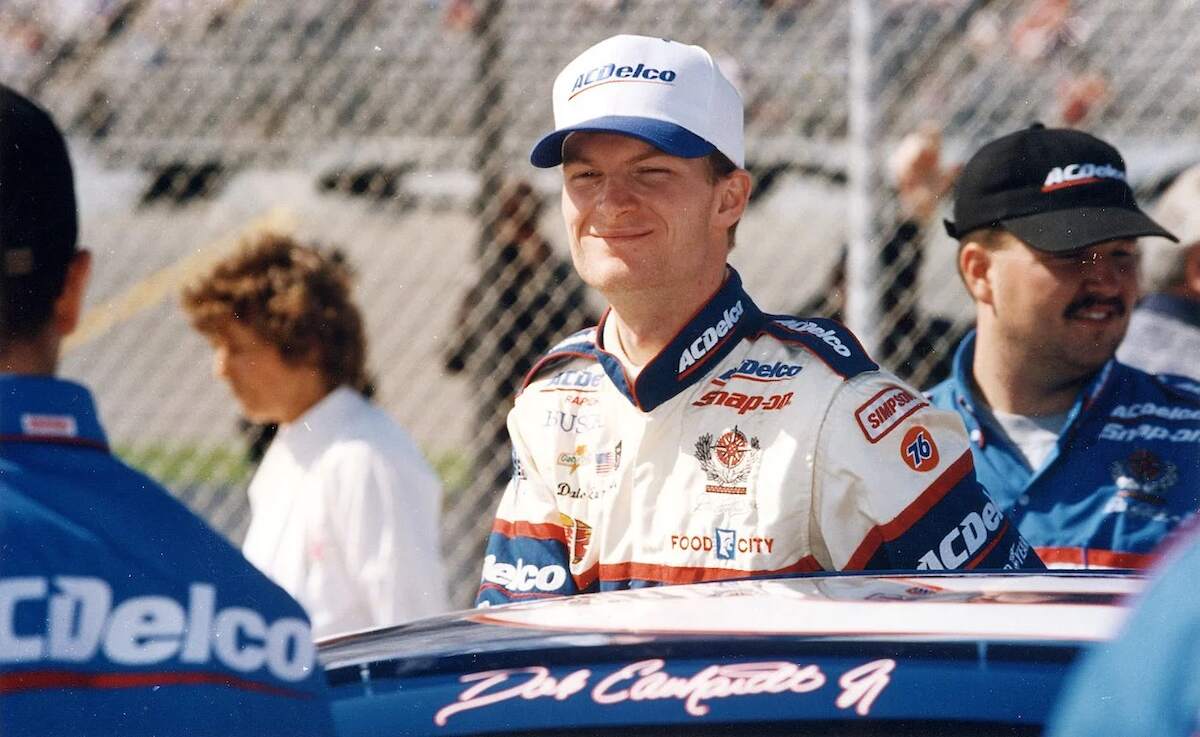 A young Dale Earnhardt Jr. smiles before a NASCAR Xfinity Series race early in his career